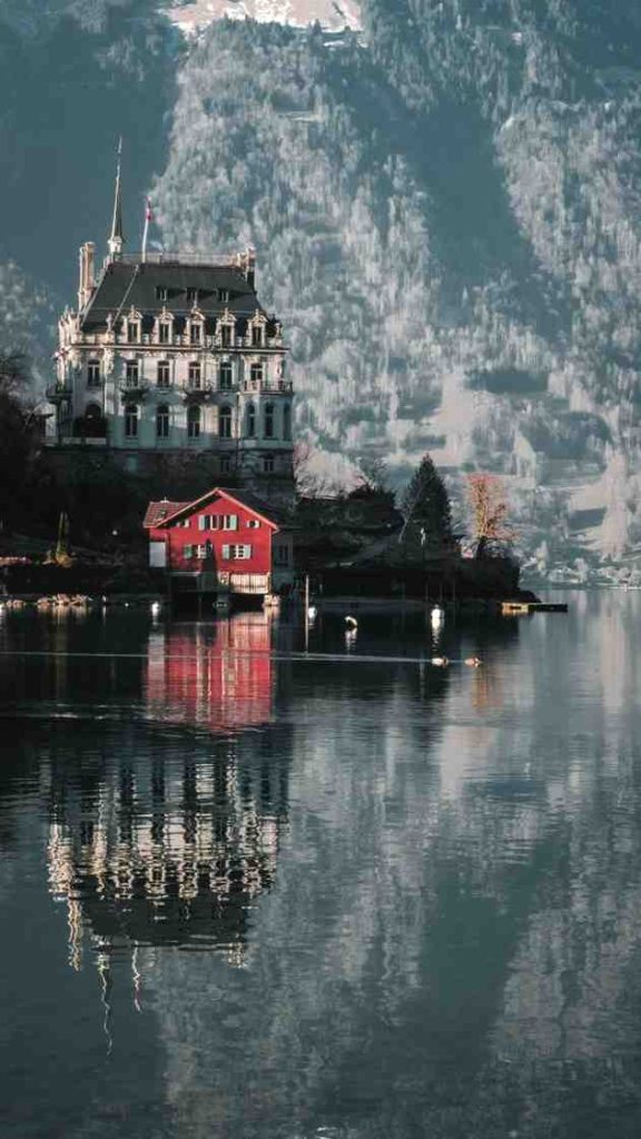 Discovering 3 Best Tourist Places in Switzerland The famous wooden landing pier in Iseltwald on Lake Brienz, one of the most popular best tourist places for K-drama fans.